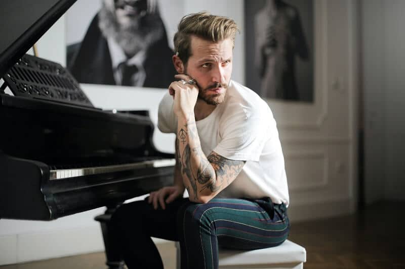 man-in-white-shirt-sitting-beside-piano-3760278_web